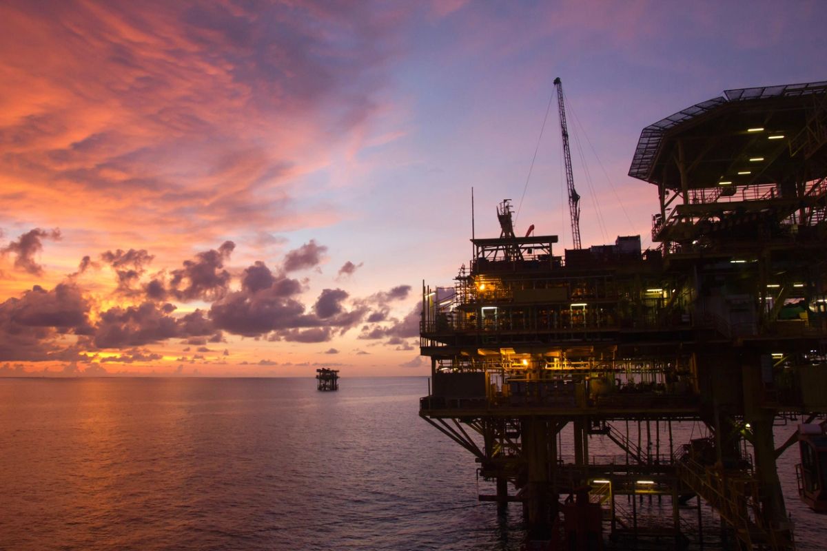 Offshore oil platform at sunset